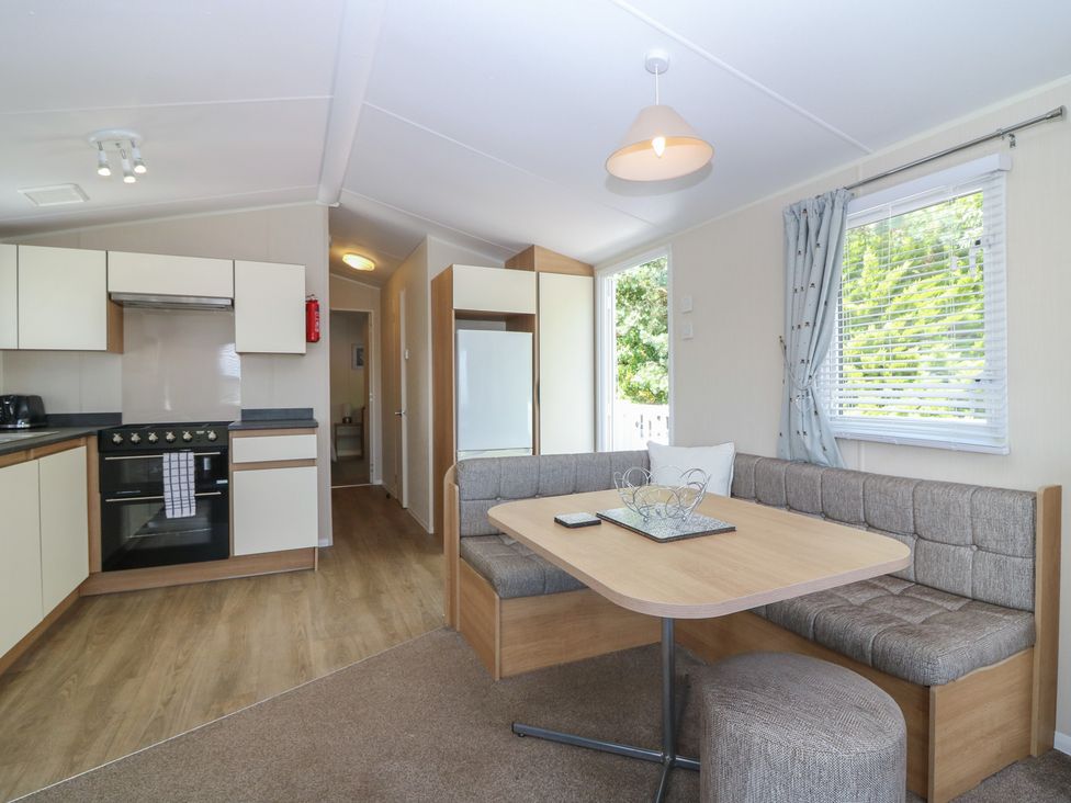A kitchen with a dining table and chairs at NO. 249 Eyemouth