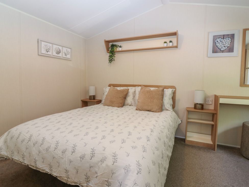 A bedroom with a bed and shelf at NO. 249 Eyemouth