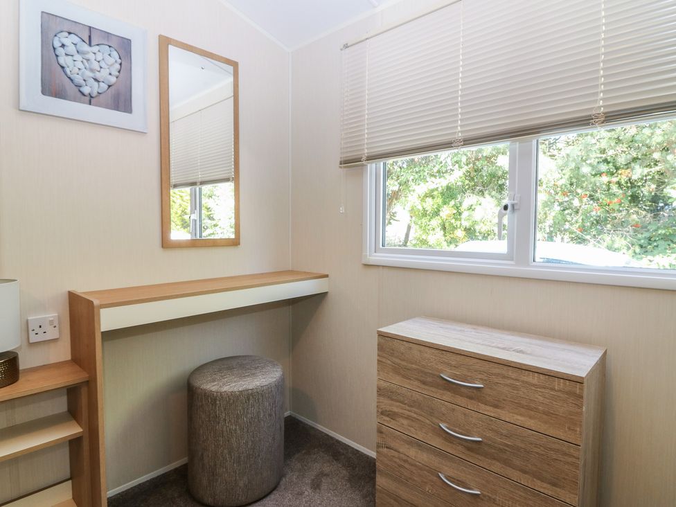 A bedroom with a desk and a chair at NO. 249 Eyemouth