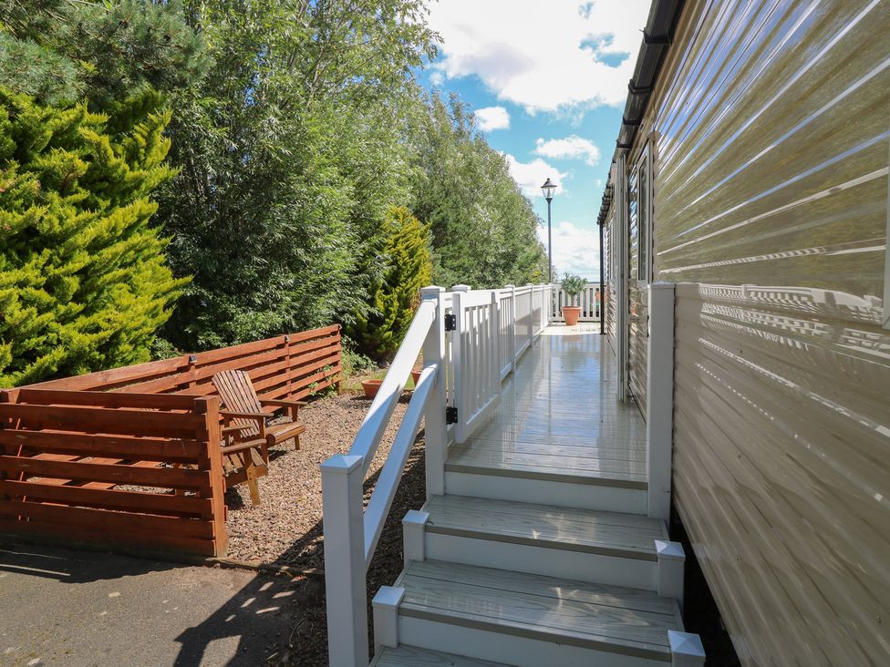 A deck with stairs leading to a path at NO. 249 in Eyemouth