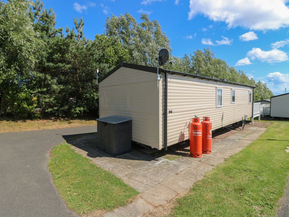 A mobile home with gas canisters outside at NO. 249 in Eyemouth