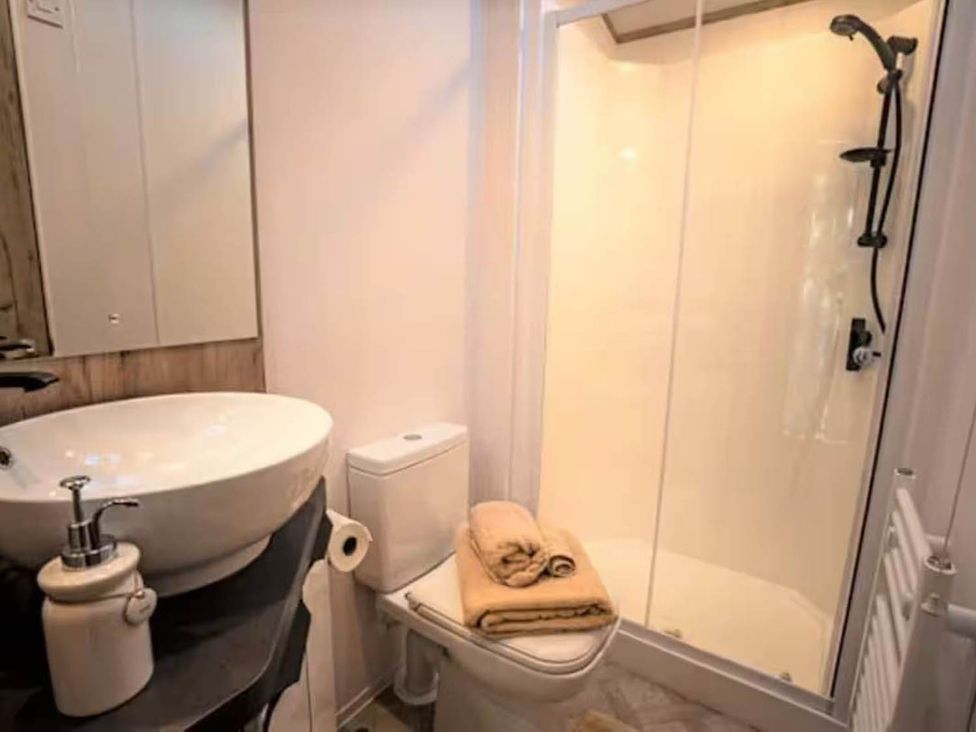 A bathroom with a sink and shower at Findhorn Lodge Peaceful Sleeps 4 Forres