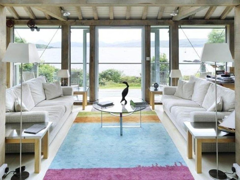 A living room with sofas and a coffee table at Tigh na Mara Sleeps 4 Sea Views Pet Friendly in Drimnin near Lochaline