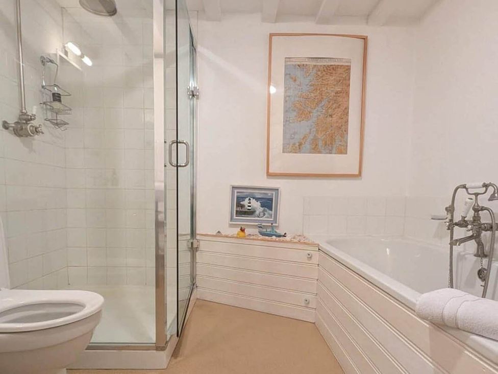 A bathroom with a shower, toilet, and bathtub at Tigh na Mara Sleeps 4 Sea Views Pet Friendly Drimnin near Lochaline