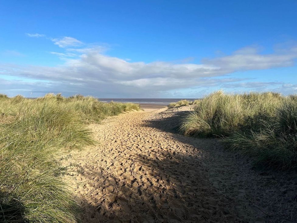 A path through sand dunes at Sea Breeze A Beautiful 3 Bed Pet Friendly Retreat Mablethorpe