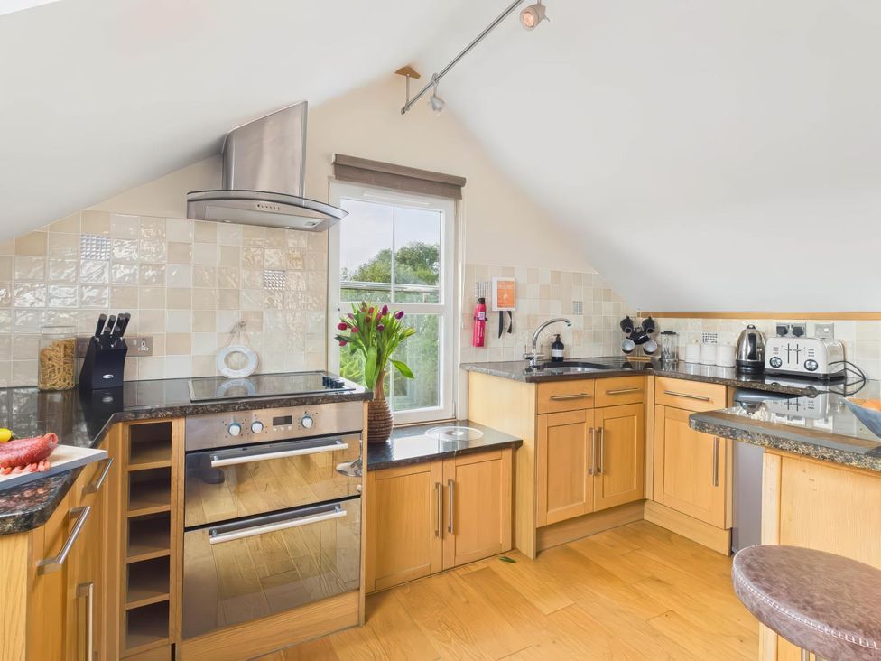 A kitchen with appliances and a window at Apartment Sleeps 4 Enclosed Garden Pets Welcome in Flushing