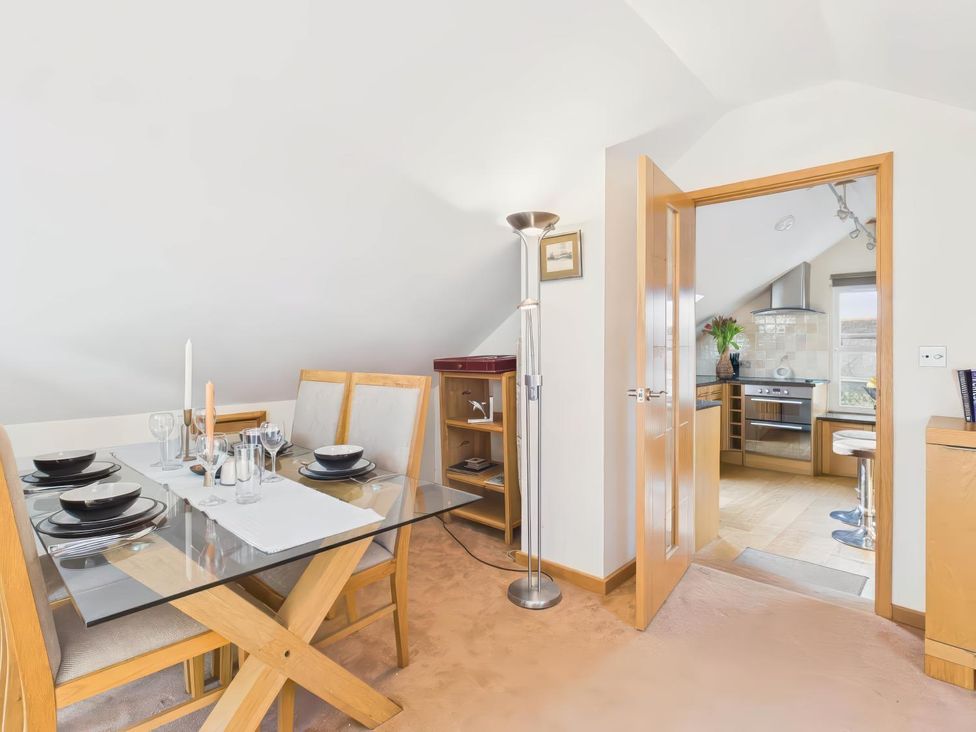 A dining room with a table set for four at Apartment Sleeps 4 Enclosed Garden Pets Welcome in Flushing