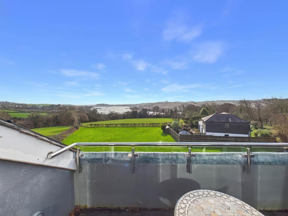 A view from a balcony overlooking fields and houses at Apartment Sleeps 4 Enclosed Garden Pets Welcome in Flushing