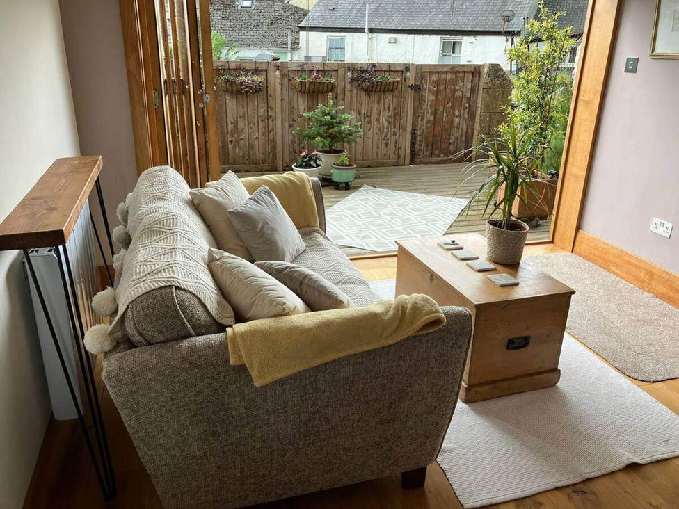 A living room with a sofa and coffee table at Old Chapel of Ermington Converted Vestry, Ermington