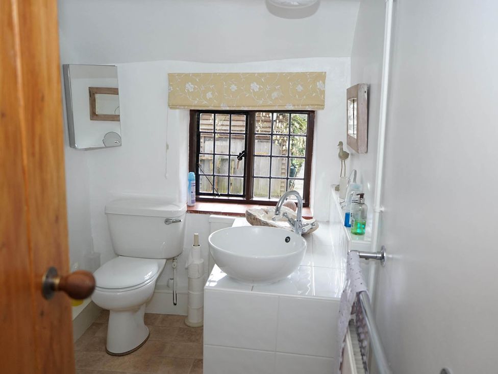 A bathroom with a toilet and wash basin at The Old Barn in Manchester