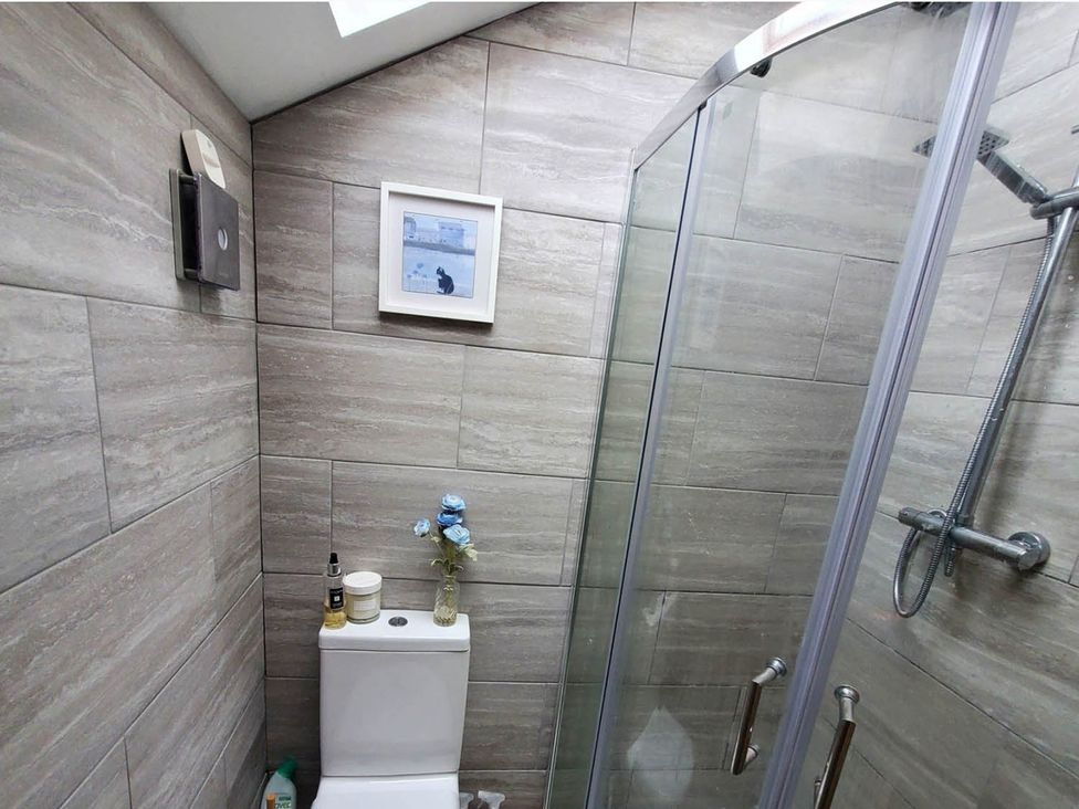 A bathroom with a shower and toilet at 3 Bedroom Cottage Hot Tub Garden Parking Dunkeswell