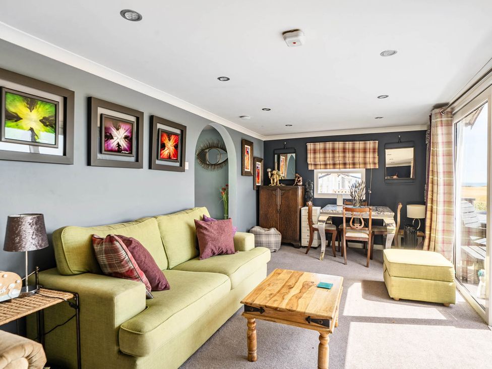 A living room with a sofa and coffee table at '' in ''