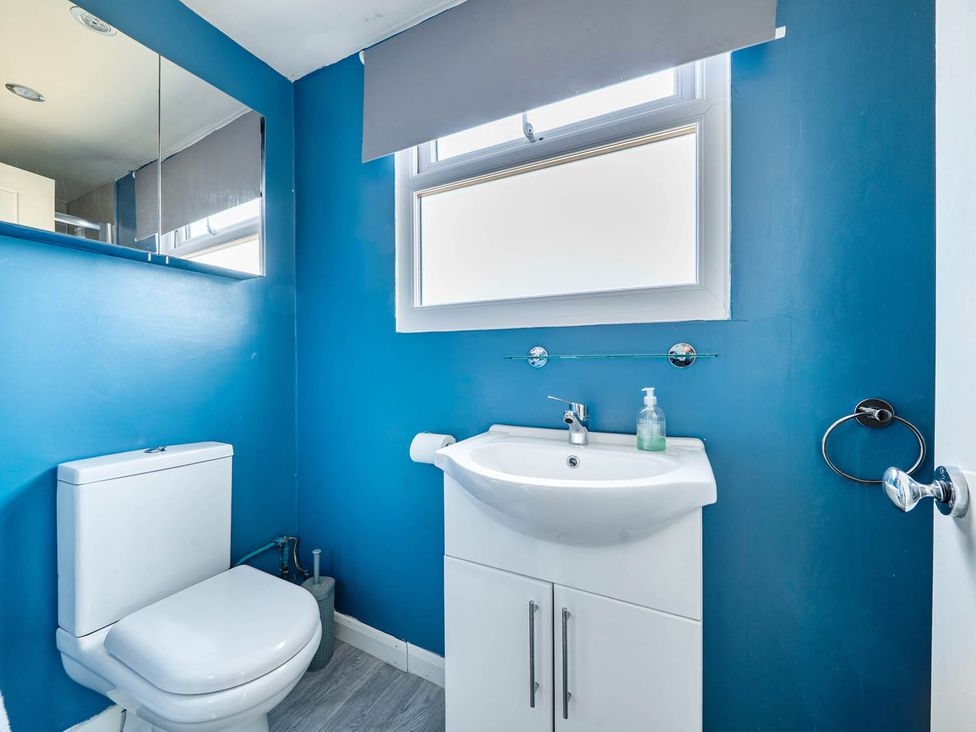 A bathroom with a sink and toilet at The Old Barn in Manchester