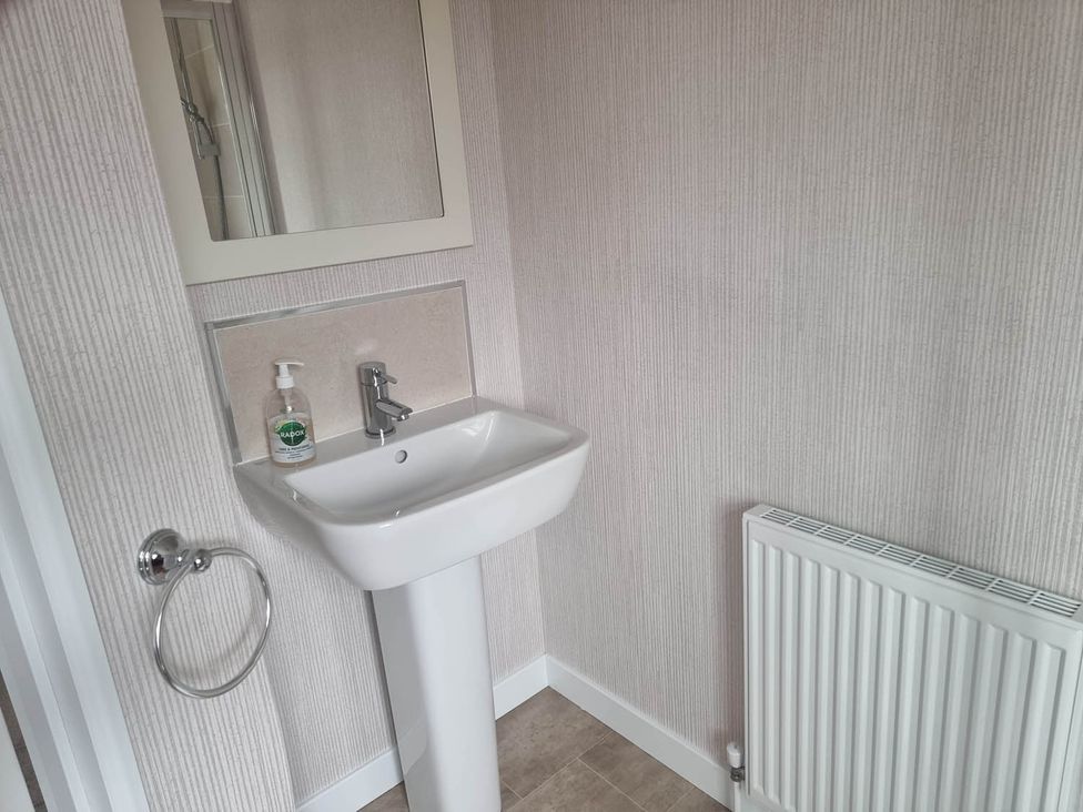 A bathroom with a sink and mirror at Pet Friendly 2Bed Luxury Lodge in Routh HotTub