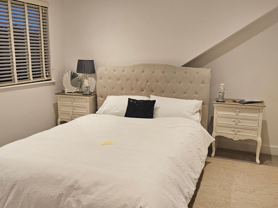 A bedroom with a bed and bedside tables at 5 Bed Sleeps 7 New Build Detached Property Monkton near Minster