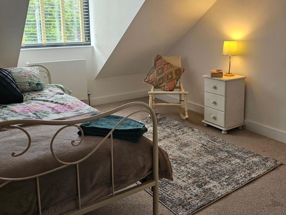 A bedroom with a bed and side table at 5 Bed Sleeps 7 New Build Detached Property Monkton near Minster