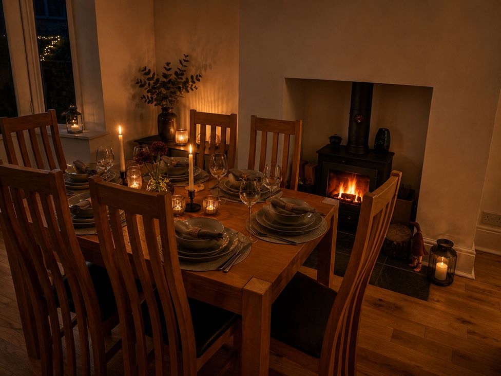 A dining room with a table and chairs at 3Bed House Sleeps 7 Parking Garden Pets Ok Lytham St. Annes