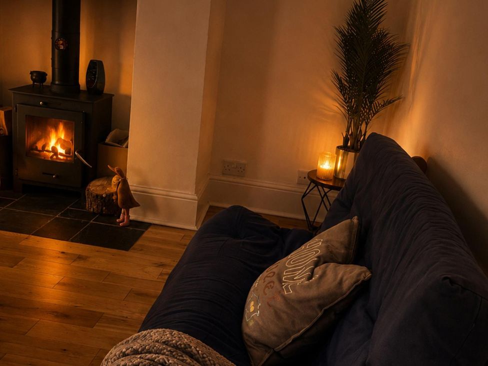 A living room with a fireplace and sofa at 3Bed House Sleeps 7 Parking Garden Pets Ok in Lytham St. Annes