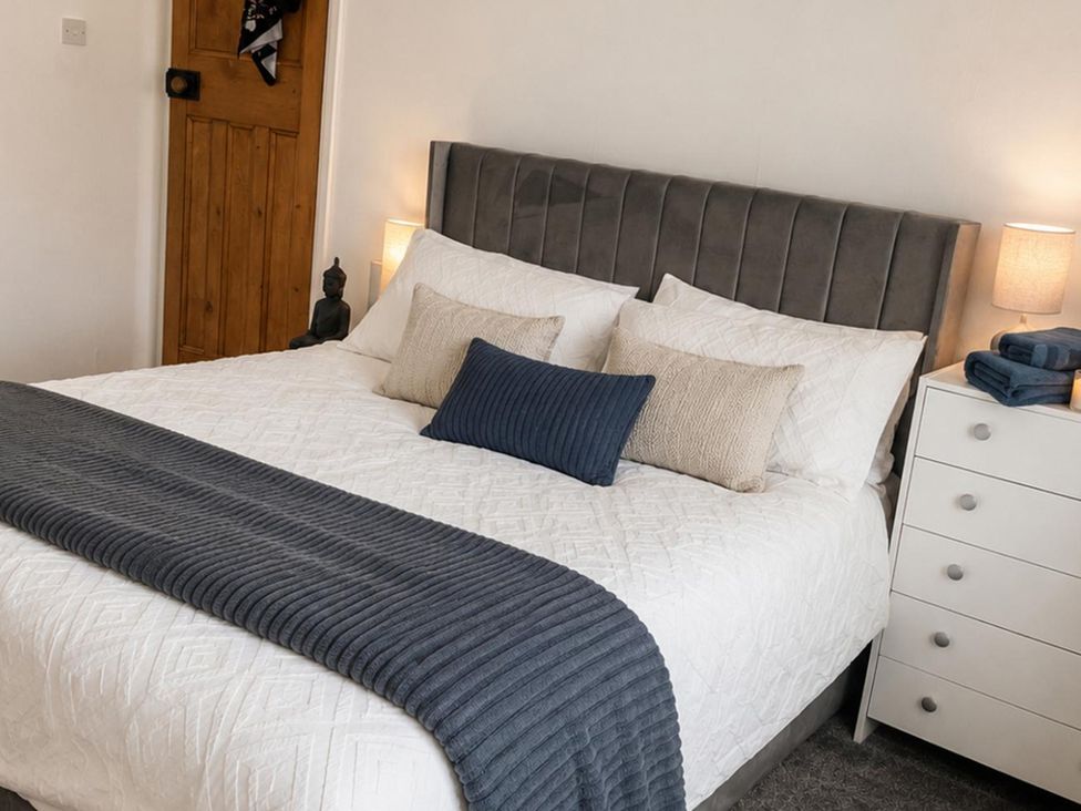 A bedroom with a bed and dresser at 3Bed House Sleeps 7 Parking Garden Pets Ok in Lytham St. Annes