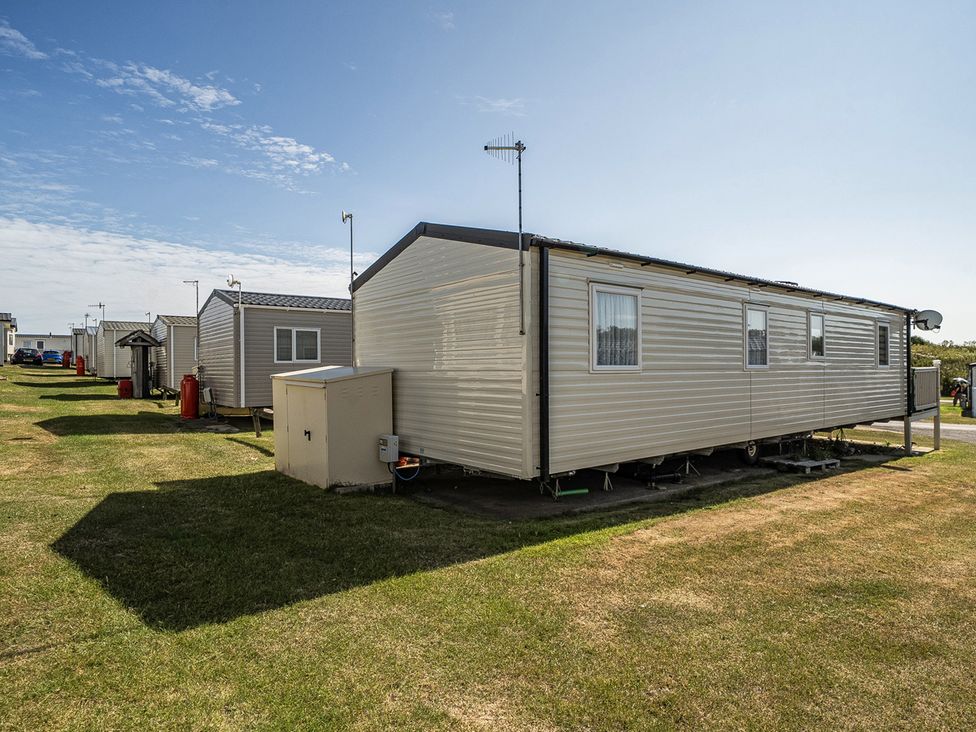 Static caravans lined up in an outdoor area at Cayton Bay Holiday Park Kestrel40, Cayton Bay
