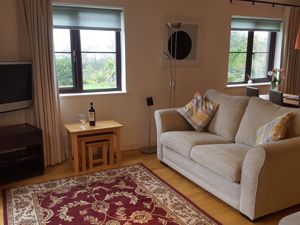 A living room with a sofa and coffee table at 2bed sleeps4 pool freeparking Trenythonestate Near Par