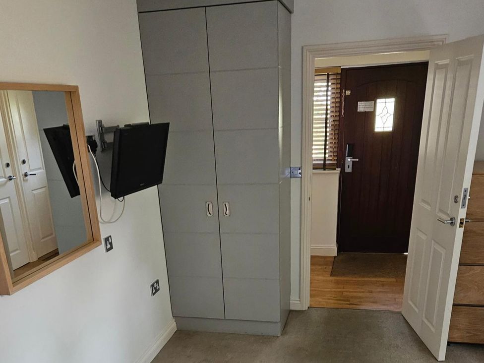 A bedroom with a wardrobe and mirror at 2bed sleeps4 pool freeparking Trenythonestate Near Par
