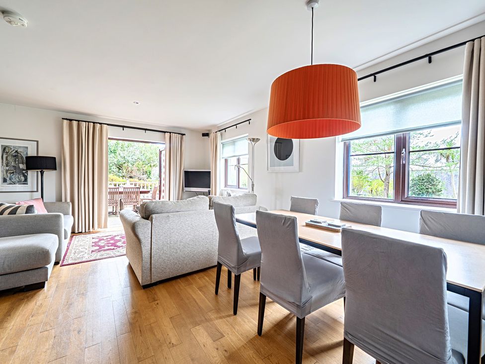 A living room with a dining area and sofas at 2bed sleeps4 pool freeparking Trenythonestate Near Par