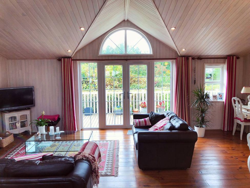 A living room with a sofa and coffee table at Stunning Sleeps 6 Luxury Lodge Pets Mercia Marina near Willington, Derbyshire