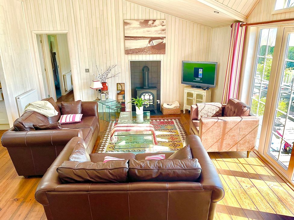 A living room with sofas and a television at Stunning Sleeps 6 Luxury Lodge Pets Mercia Marina near Willington, Derbyshire