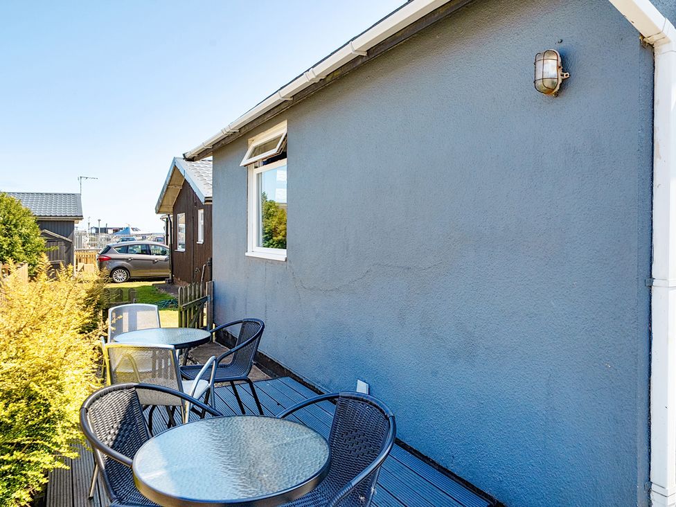 An outdoor area with tables and chairs at Seahorse Chalet Sleeps 6 Pets Log Burner Beach in Bridlington