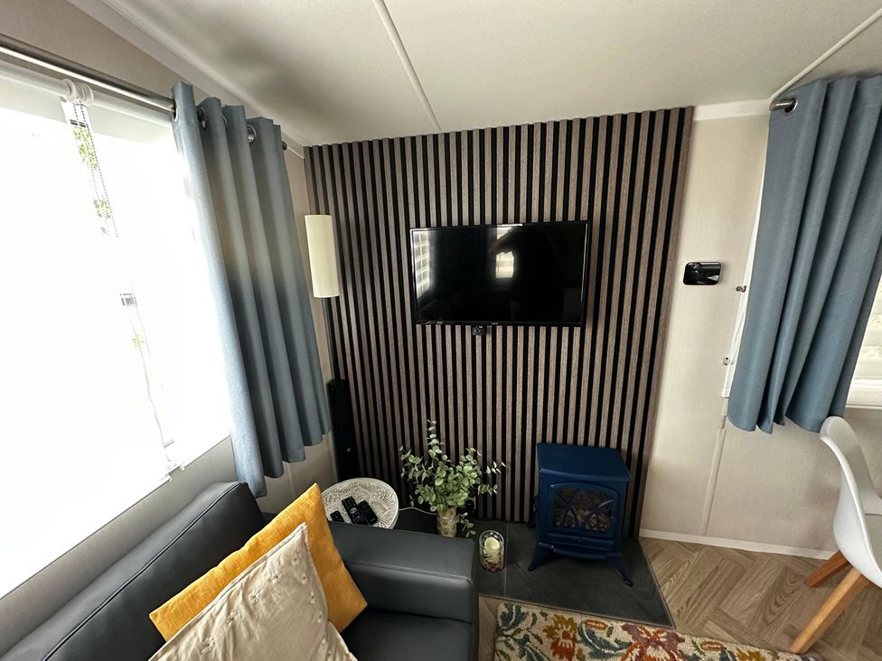 A living room with a sofa and television at the property in an unknown location