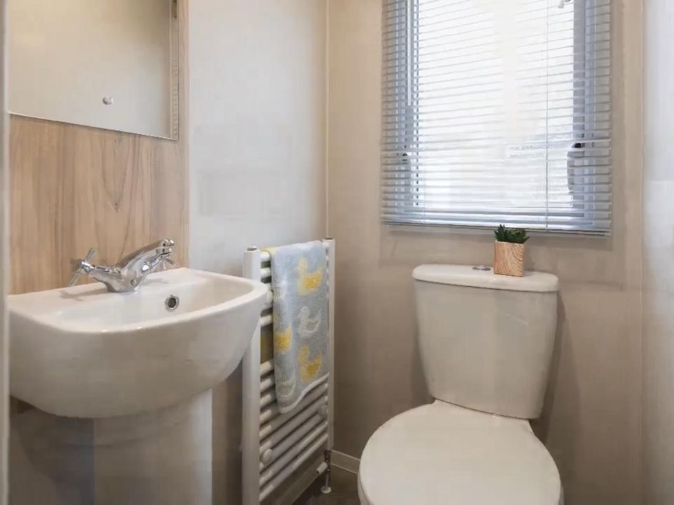 A bathroom with a sink and toilet at The Old Barn in Manchester