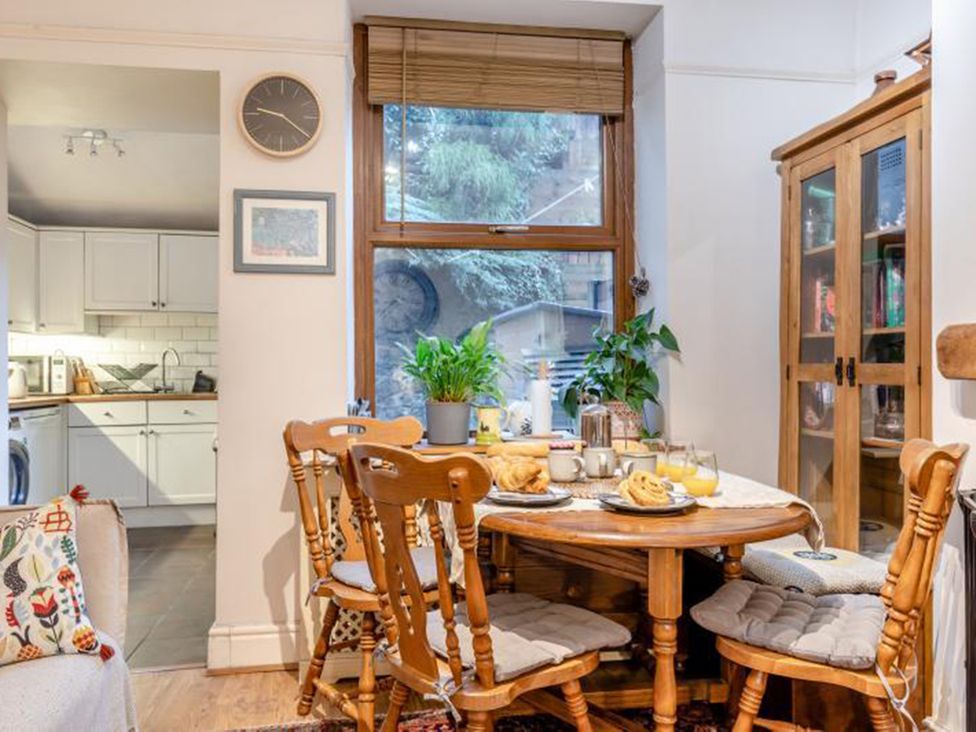 A dining room with a table and chairs at The Old Barn in Manchester