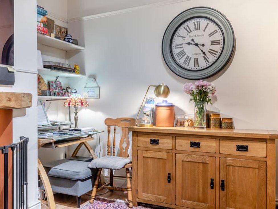 An office area with a desk and shelving at a property in 