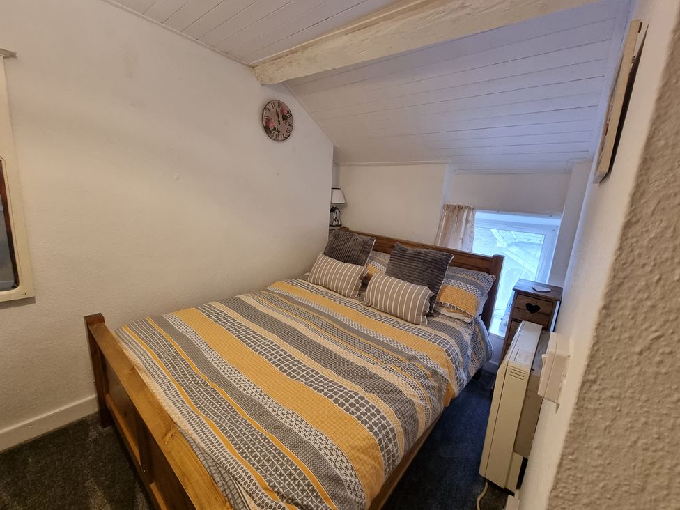 A bedroom with a bed and window at the property in location