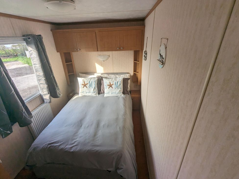 A bedroom with a double bed and window at the property