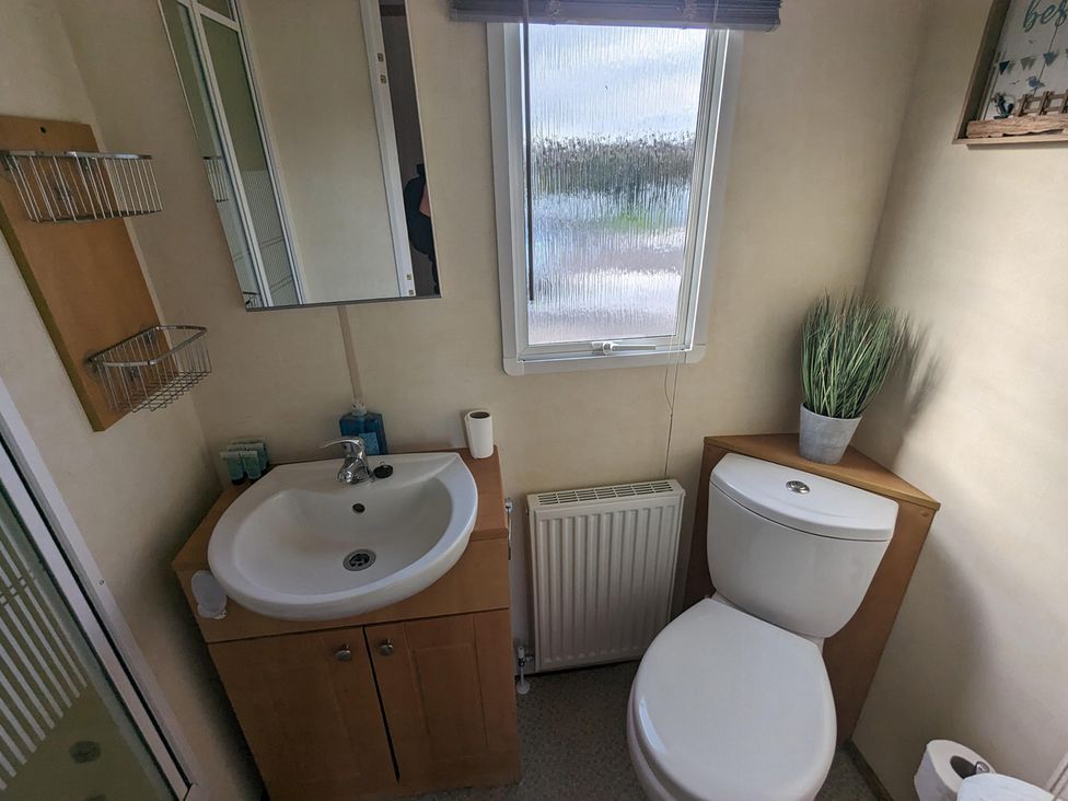 A bathroom with a sink and toilet at 