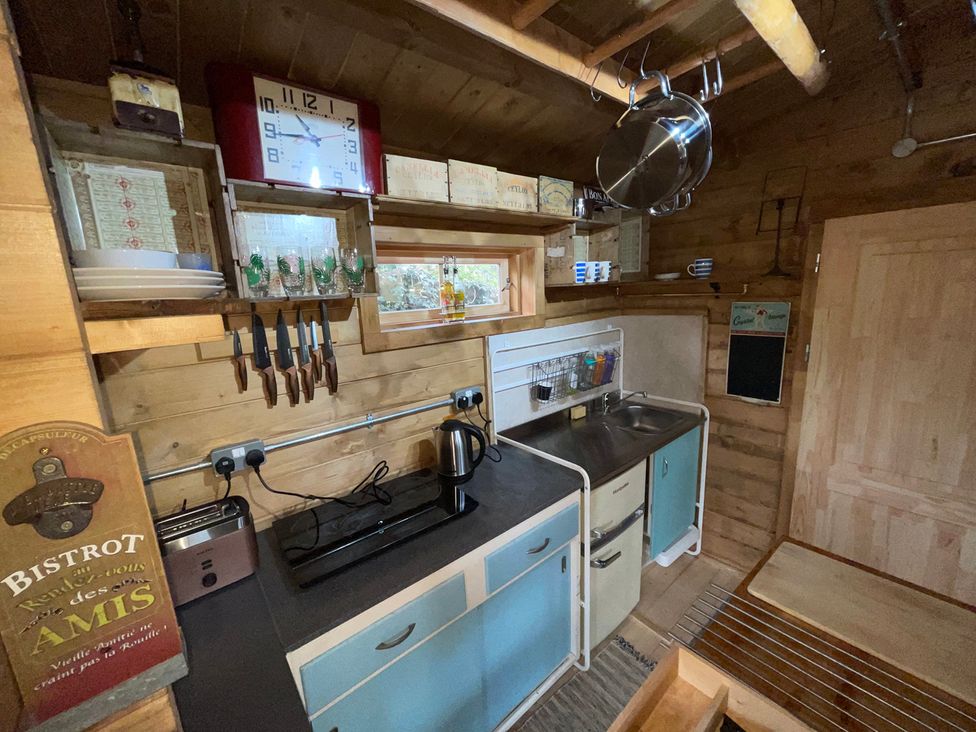 A kitchen with a sink and cabinets at 