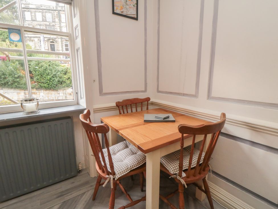 A dining room with a table and chairs at The Hyding Place in Whitby
