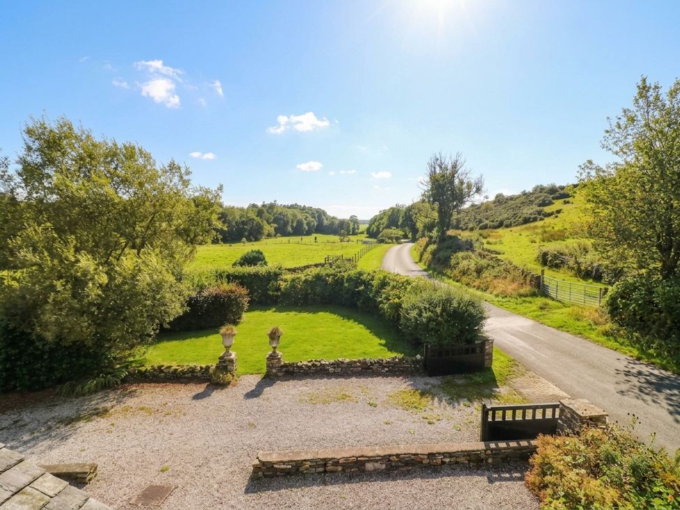 A view of a field and road at Three Mile House in Carnforth