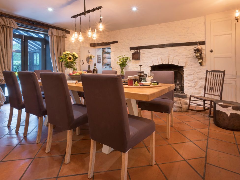 A dining room with a table and chairs at Three Mile House in Carnforth