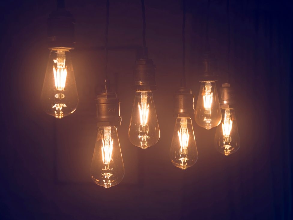 Hanging light bulbs with filament at Three Mile House in Carnforth