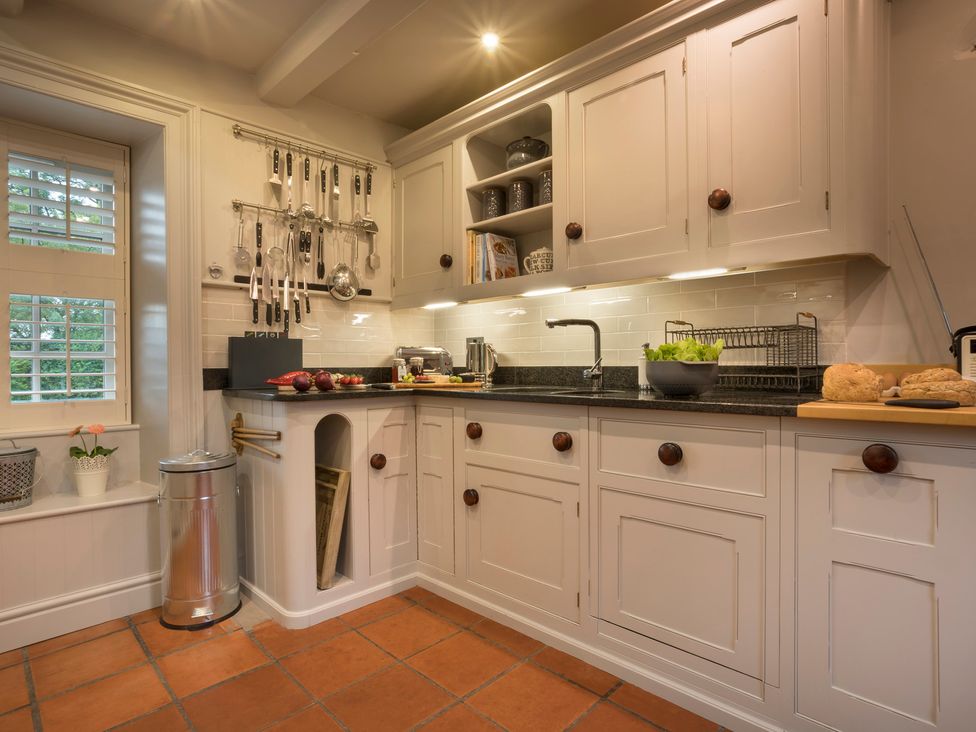 A kitchen with a sink and countertop at Three Mile House in Carnforth