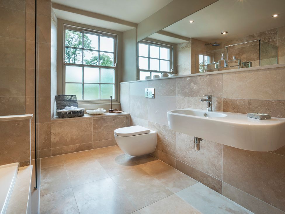 A bathroom with a sink and toilet at Three Mile House in Carnforth