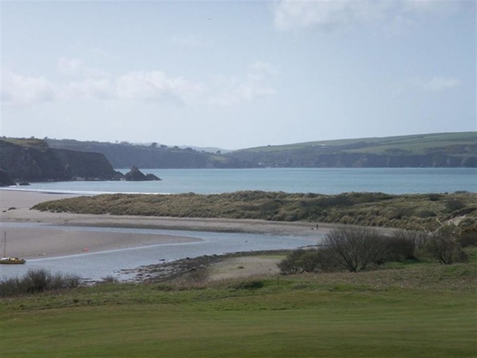 A beach and water view at Llys Gwaun in Fishguard
