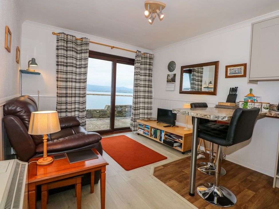 A living room with a view of the sea at Aldena South Snowdon Wharf in Porthmadog