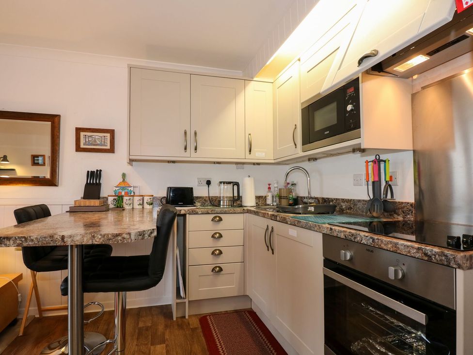 A kitchen with countertop and appliances at Aldena South Snowdon Wharf Porthmadog