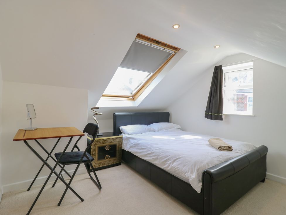 A bedroom with a bed, desk, and chair at 2B Granville Road Colchester