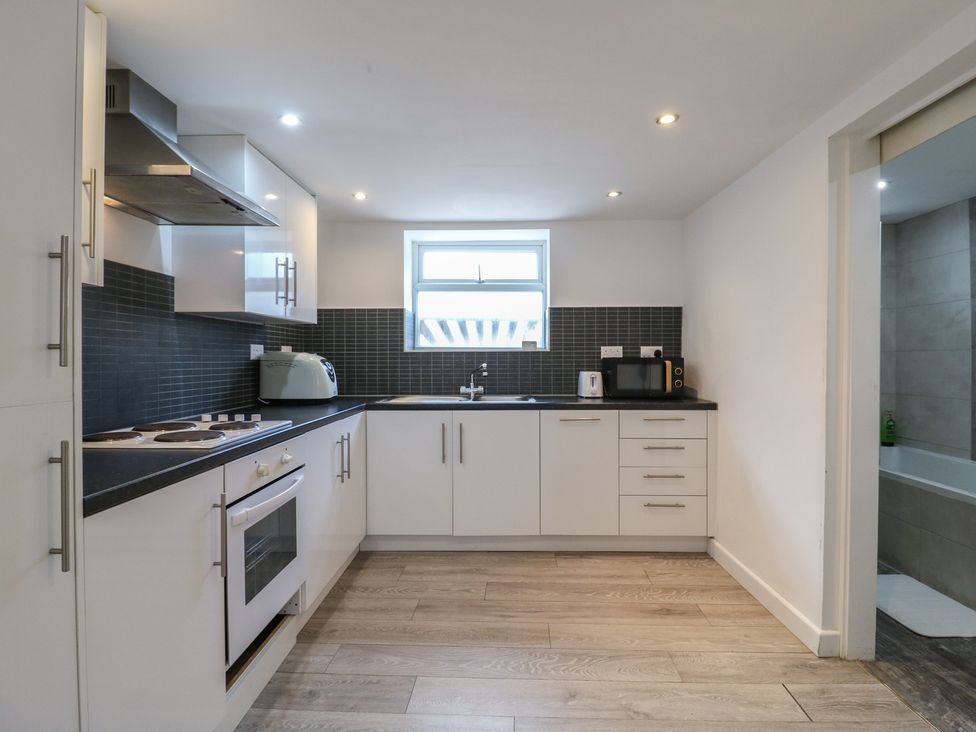 A kitchen with appliances and countertop at 2B Granville Road, Colchester