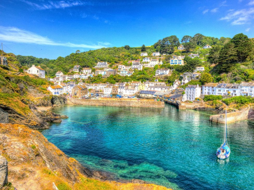 A coastal view with houses and boats at 5 Tree Tops in Dobwalls